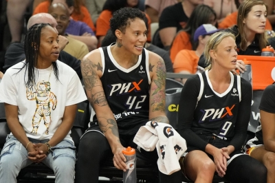 Brittney Griner (center) watches from the bench as the Mercury face the Sky on May 21, 2023. Griner was detained in Russia for nine months after being arrested on drug charges in 2022.
