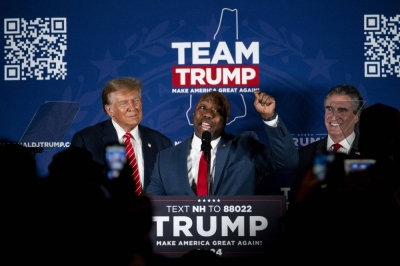 Senator Tim Scott (center), a Republican from South Carolina, speaks during a campaign event with former U.S. President Donald Trump, (left), and Doug Burgum (right), governor of North Dakota, in Laconia, New Hampshire, in January.