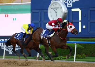 Forever Young, ridden by jockey Ryusei Sakai, runs during the UAE Derby in Dubai on March 30.