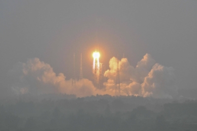 A Long March 5 rocket, carrying the Chang'e-6 mission lunar probe, lifts off as it rains at the Wenchang Space Launch Center in southern China's Hainan Province on Friday.