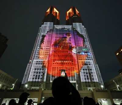A 100-meter-tall life-size Godzilla is displayed on the Tokyo Metropolitan Government Building using projection mapping.