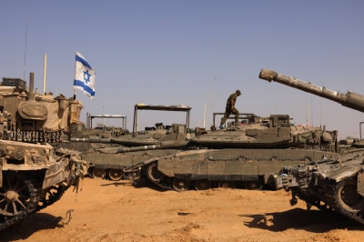 Israeli tanks sit near a border crossing to the southern Gaza Strip, in Israel, on Sunday.