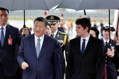 French Prime Minister Gabriel Attal greets Chinese leader Xi Jinping at Orly Airport, south of Paris, on Sunday. 