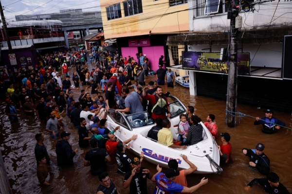 People are rescued after flooding in Canoas, at the southern Brazilian state of Rio Grande do Sul on Sunday.