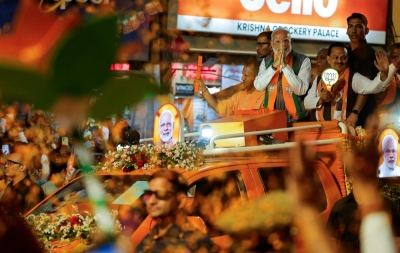 Indian Prime Minister Narendra Modi and Chief Minister of Uttar Pradesh Yogi Adityanath attend an election campaign rally in Kanpur, India, on Sunday.