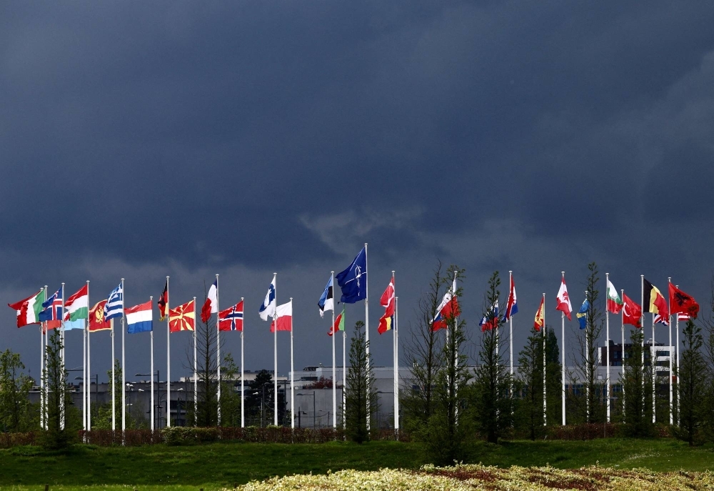 National flags of the Alliance's members flutter at the NATO headquarters in Brussels.