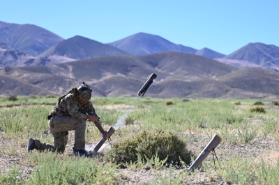 A U.S. Naval Special Warfare Operator fires a Switchblade 300 loitering munition during training exercises in Fallon, Nevada, last July. The U.S. Defense Department plans to use small drones — known in the Pentagon as “all-domain attritable autonomous systems” — to help counter Chinese military systems and tactics.