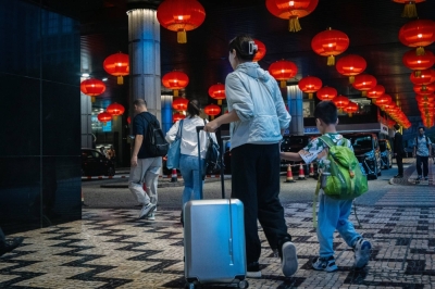 Visitors in Macau on May 2. More than a year since China reopened its borders, some 63% of its residents say they’re ready to return to exploring the world, according to a survey published on April 24. 