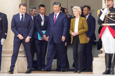 French President Emmanuel Macron, Chinese leader Xi Jinping and European Commission chief Ursula von der Leyen walk after their meeting in Paris on Monday.