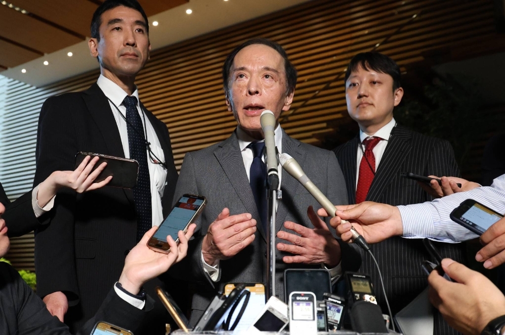 Bank of Japan Gov. Kazuo Ueda speaks to reporters on Tuesday at the Prime Minister's Office following a meeting with Prime Minister Fumio Kishida.