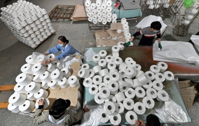 Workers on the production line at a cotton textile factory in Korla, Xinjiang Uighur Autonomous Region, China, on April 1, 2021