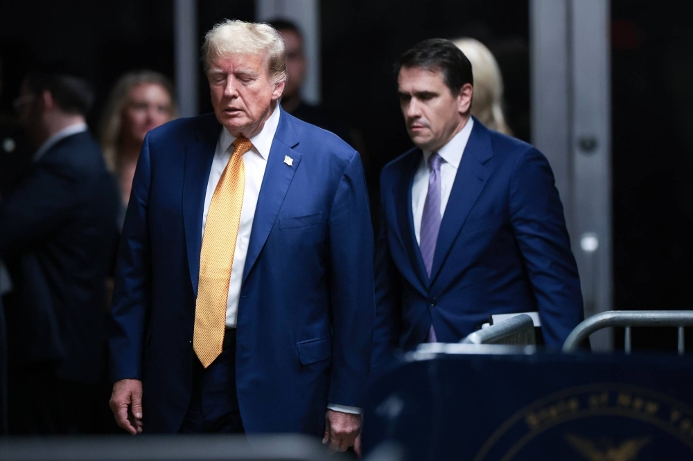 Former U.S. President Donald Trump and his attorney, Todd Blanche, at Manhattan criminal court in New York on Tuesday. Trump faces 34 felony counts of falsifying business records as part of an alleged scheme to silence claims of extramarital sexual encounters during his 2016 presidential campaign.