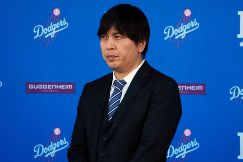 Ippei Mizuhara, seen during Shohei Ohtani's introductory news conference with the Dodgers in December 2023, has agreed to plead guilty to charges of bank fraud and filing a false tax return.