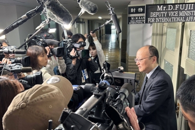 Masato Kanda, vice finance minister for international affairs, speaks to reporters in Tokyo on April 30.