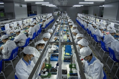 Workers make pods for e-cigarettes on the production line at Kanger Tech, one of China's leading manufacturers of vaping products, on Sept. 24, 2019 in Shenzhen, China.