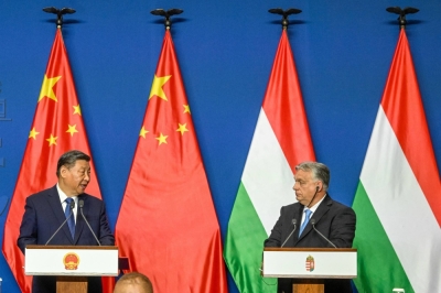 Hungarian Prime Minister Viktor Orban and Chinese President Xi Jinping hold a joint news conference at the Carmelite Monastery in Budapest, Hungary, on Thursday.