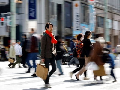 People in a shopping district in Tokyo in March