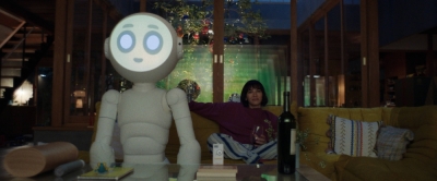 After losing her family to a plane accident, Suzie (played by Rashida Jones) receives a posthumous gift from her husband in the form of a robot named Sunny (voiced by Joanna Sotomura). After losing her family to a plane accident, Suzie (played by Rashida Jones) receives a posthumous gift from her husband in the form of a robot named Sunny (voiced by Joanna Sotomura).