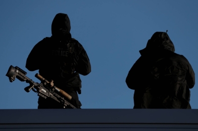 United States Secret Service Counter Snipers stand guard on a rooftop during a campaign rally for U.S. President Donald Trump in Avoca, Pennsylvania, in 2020. United States Secret Service Counter Snipers stand guard on a rooftop during a campaign rally for U.S. President Donald Trump in Avoca, Pennsylvania, in 2020.