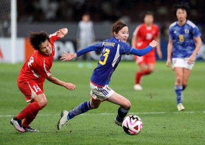 Japan's Hikaru Kitagawa dribbles past a defender during an Olympic qualifying match against North Korea at National Stadium in Tokyo in February. Japan's Hikaru Kitagawa dribbles past a defender during an Olympic qualifying match against North Korea at National Stadium in Tokyo in February.