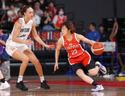 Mai Yamamoto drives to the basket during an Olympic tune-up game against New Zealand in Tokyo on July 4. Mai Yamamoto drives to the basket during an Olympic tune-up game against New Zealand in Tokyo on July 4.