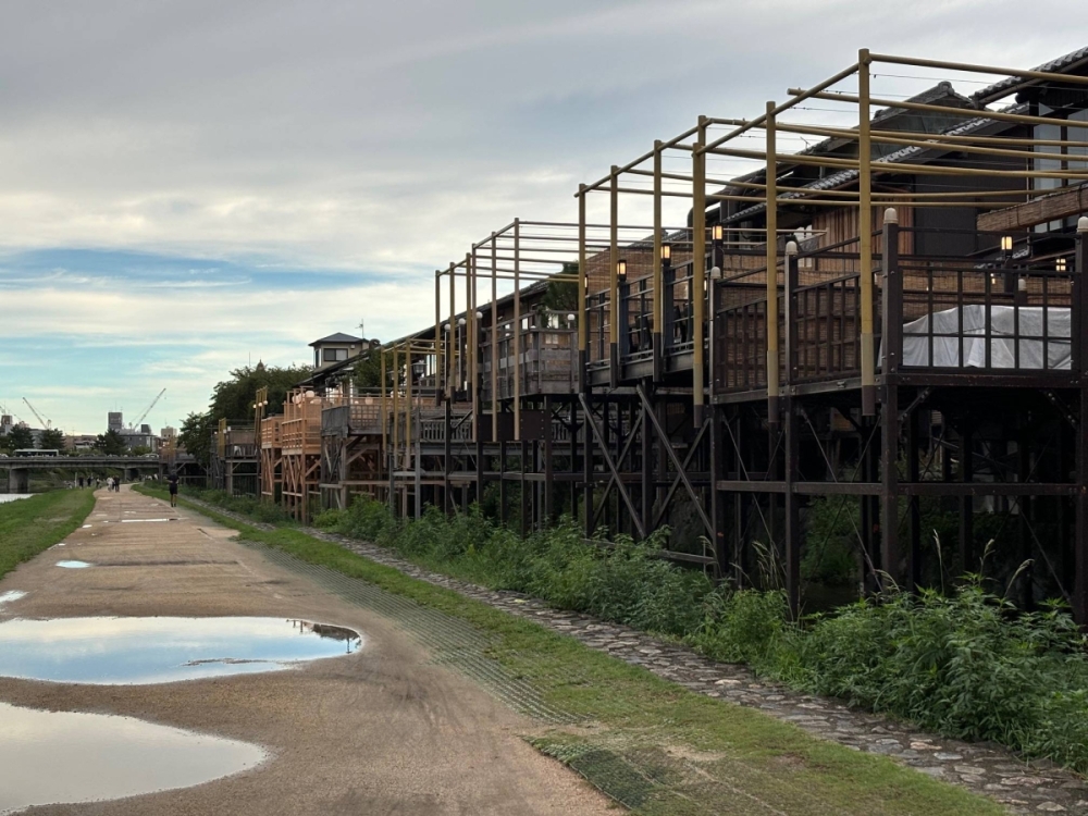 The Kamo River is such a central element of life in Kyoto that restaurants adjacent to the river regularly erect elevated platforms for diners to enjoy some cooling breezes while they eat. The Kamo River is such a central element of life in Kyoto that restaurants adjacent to the river regularly erect elevated platforms for diners to enjoy some cooling breezes while they eat.