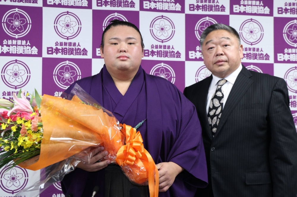 Takakeisho (left) and his stablemaster, Tokiwayama, after his retirement news conference in Tokyo on Saturday. Takakeisho (left) and his stablemaster, Tokiwayama, after his retirement news conference in Tokyo on Saturday.
