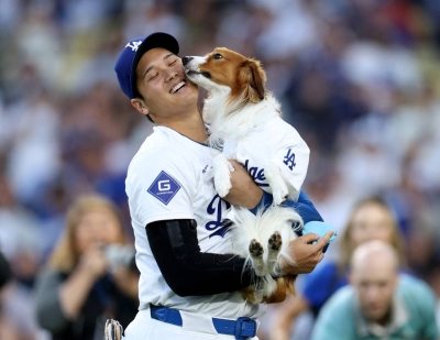 Dodgers star Shohei Ohtani and his dog, Dekopin, who delivered the ceremonial first pitch prior to a game against the Orioles on Aug. 28 Dodgers star Shohei Ohtani and his dog, Dekopin, who delivered the ceremonial first pitch prior to a game against the Orioles on Aug. 28