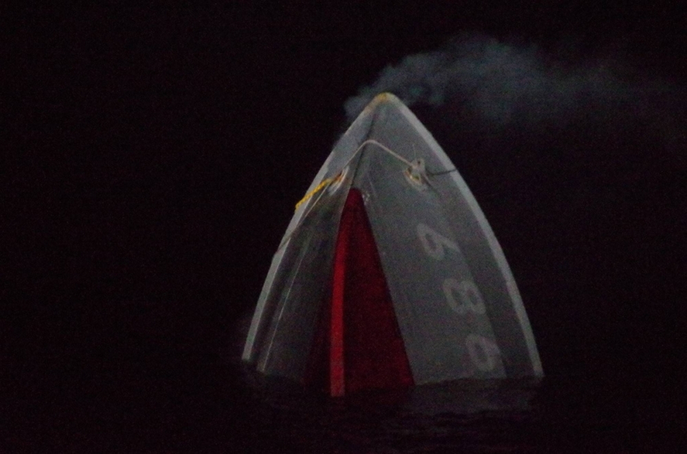 The bow of the Maritime Self-Defense Force's Ukushima minesweeper is seen early Monday after most of the ship was submerged in waters off Fukuoka Prefecture following a fire that erupted in its engine room.  The bow of the Maritime Self-Defense Force's Ukushima minesweeper is seen early Monday after most of the ship was submerged in waters off Fukuoka Prefecture following a fire that erupted in its engine room.