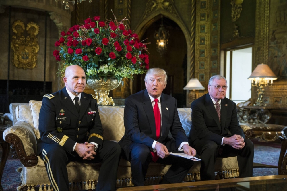 Then-President Donald Trump (center) speaks alongside then-national security adviser Lt. Gen. H.R. McMaster (left) and Kellogg at the Mar-a-Lago resort in Palm Beach, Florida, on Feb. 20, 2017. Then-President Donald Trump (center) speaks alongside then-national security adviser Lt. Gen. H.R. McMaster (left) and Kellogg at the Mar-a-Lago resort in Palm Beach, Florida, on Feb. 20, 2017.
