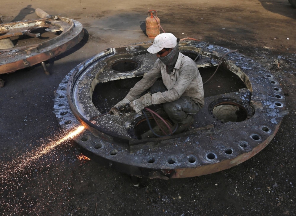 A worker uses a wielding machine to dismantle a part of a decommissioned ship in the western Indian state of Gujarat. In the coming decade, about 15,000 ships — or one in eight of the entire global fleet — will come into shipyards for recycling: twice the amount of the past decade, according to a new report. A worker uses a wielding machine to dismantle a part of a decommissioned ship in the western Indian state of Gujarat. In the coming decade, about 15,000 ships — or one in eight of the entire global fleet — will come into shipyards for recycling: twice the amount of the past decade, according to a new report.