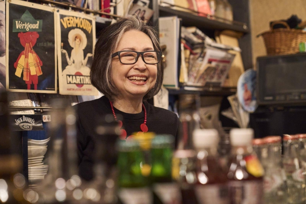 Bar owner Sawano Kazuko shares her story of spontaneity and acceptance, highlighting the welcoming atmosphere of Golden Gai. Bar owner Sawano Kazuko shares her story of spontaneity and acceptance, highlighting the welcoming atmosphere of Golden Gai.