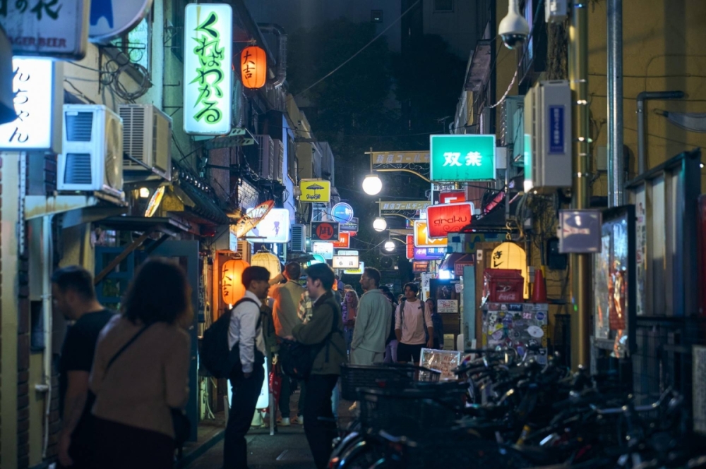 Golden Gai's narrow streets come alive at night. Golden Gai's narrow streets come alive at night.