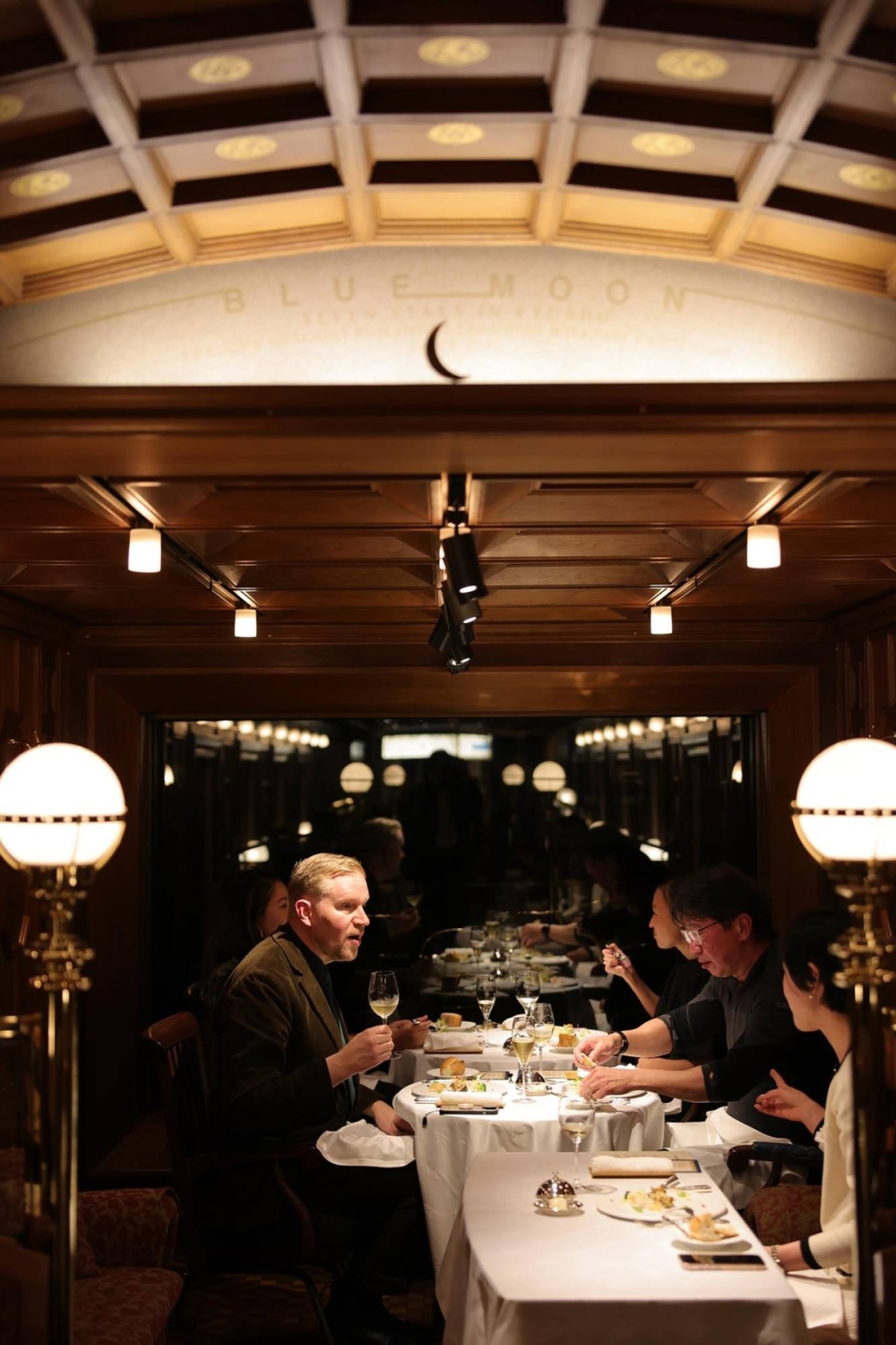 The dining car aboard the Seven Stars exudes the typical wood-paneled look of the train's interior spaces. The dining car aboard the Seven Stars exudes the typical wood-paneled look of the train's interior spaces.