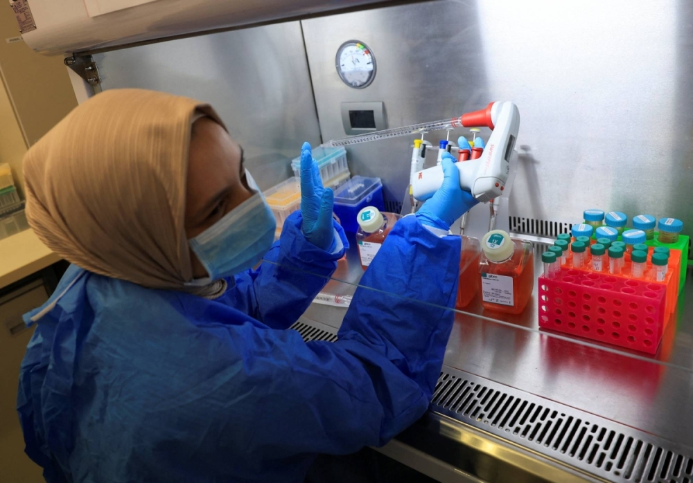 A scientific officer works in the research lab at the University of Cape Town's Institute of Infectious Disease and Molecular Medicine, in Cape Town, South Africa on Feb. 17. A scientific officer works in the research lab at the University of Cape Town's Institute of Infectious Disease and Molecular Medicine, in Cape Town, South Africa on Feb. 17.