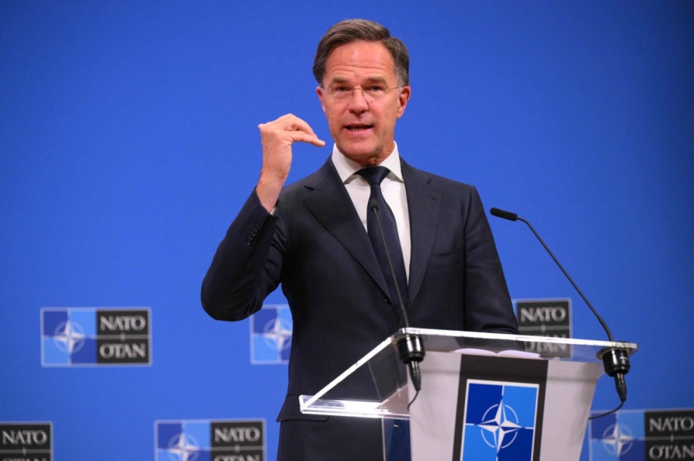 NATO Secretary-General Mark Rutte delivers remarks during a news conference at alliance headquarters in Brussels on Friday.