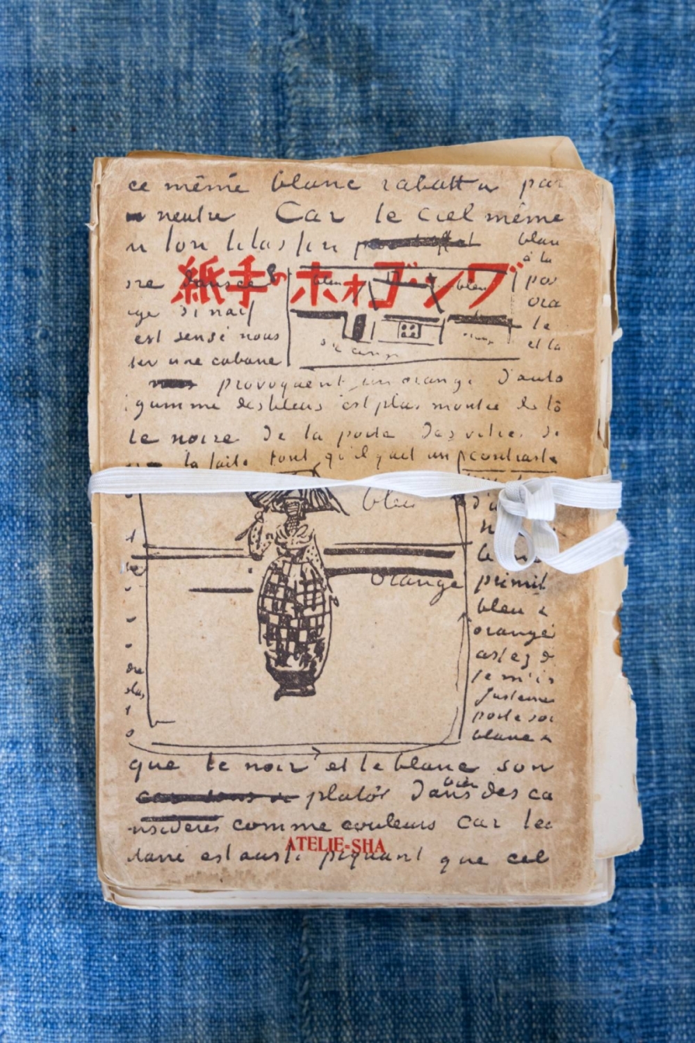 Inside Hiroko Inoue's atelier are artworks, prayer books and handwritten notes. Inside Hiroko Inoue's atelier are artworks, prayer books and handwritten notes.