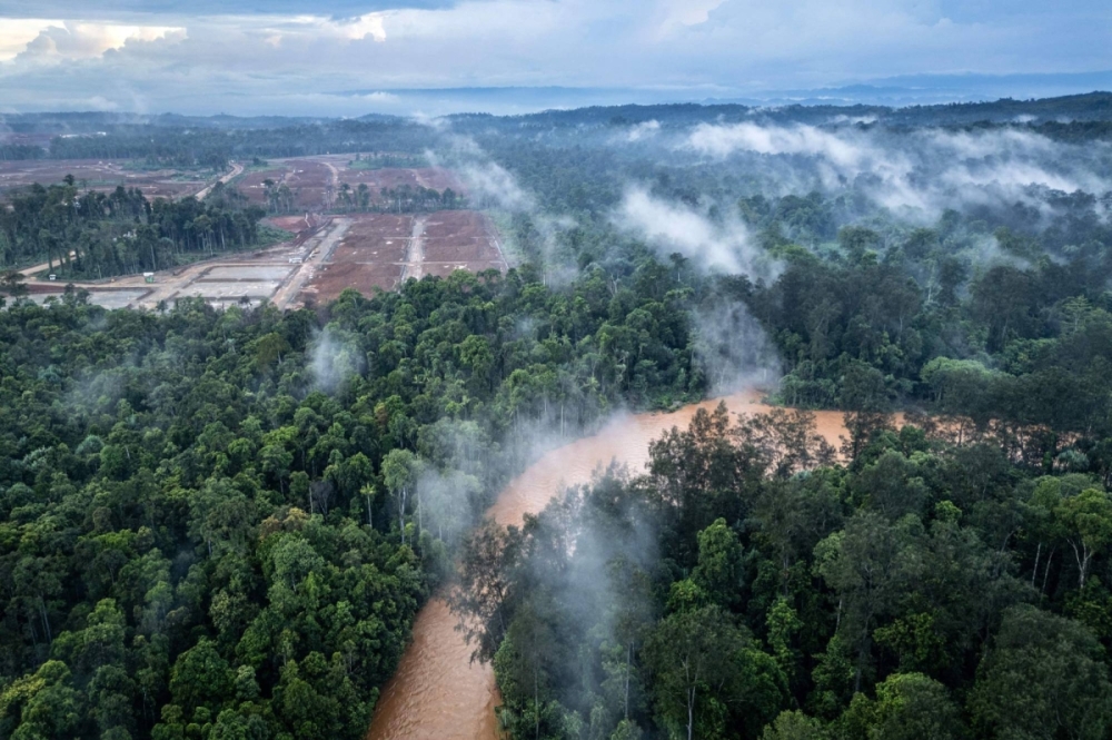 A nickel mining site, constructed after forests were cleared, sits next to a river locals say has been contaminated by mining operations in Central Halmahera, North Maluku, Indonesia, on April 14. A nickel mining site, constructed after forests were cleared, sits next to a river locals say has been contaminated by mining operations in Central Halmahera, North Maluku, Indonesia, on April 14.