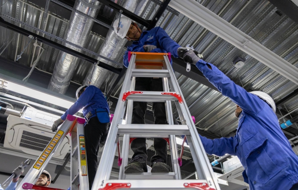 Trainees practice installing an air conditioner at a Daikin facility in Phnom Penh. Daikin has vowed to reach net-zero emissions by 2050 as it seeks to rollout more efficient products. Trainees practice installing an air conditioner at a Daikin facility in Phnom Penh. Daikin has vowed to reach net-zero emissions by 2050 as it seeks to rollout more efficient products.