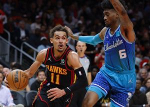 STILL BREATHING Trae Young (11) of the Atlanta Hawks tries to get past Jalen McDaniels (6) of the Charlotte Hornets during the second half at State Farm Arena on Wednesday, April 13, 2022, (April 14 in Manila) in Atlanta, Georgia. PHOTO BY TODD KIRKLAND/AFP
