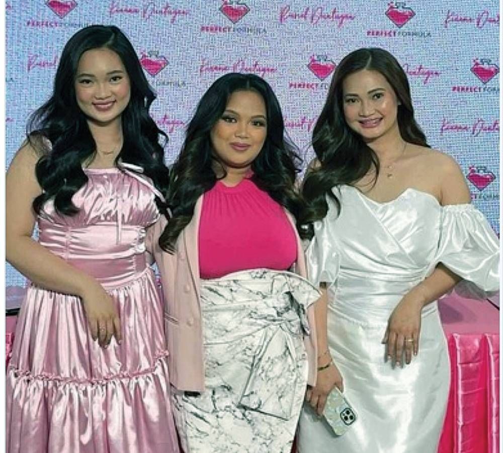 Perfect Formula CEO Ehderly Garcia (center)with mother-daughter TikTokers Russel andKianna Duntugan.