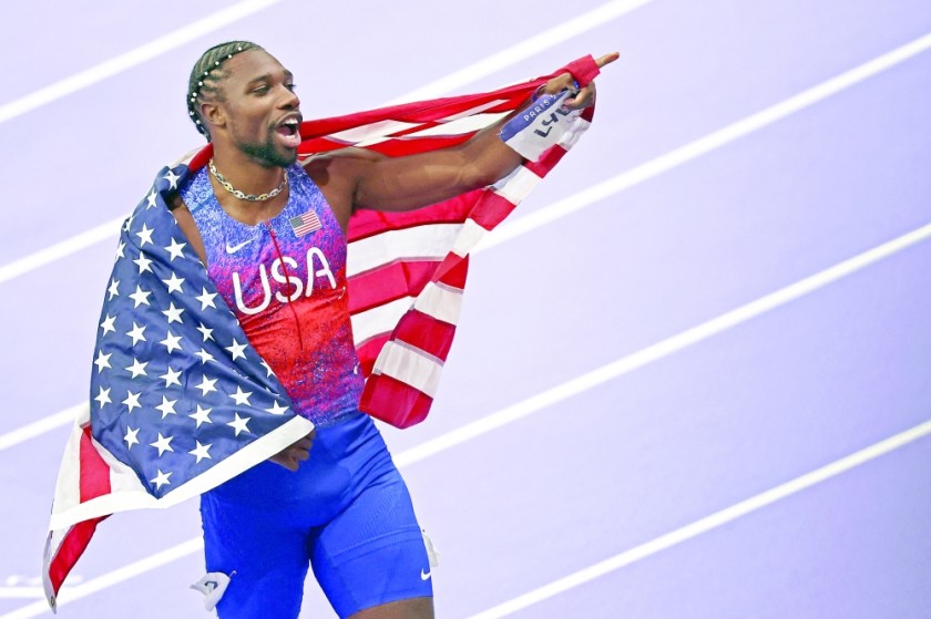 American athlete Noah Lyles celebrates after winning the men's 100m final in track and field during the Paris 2024 Olympic Games at the Stade de France in Saint-Denis, north of Paris, on August 4, 2024.