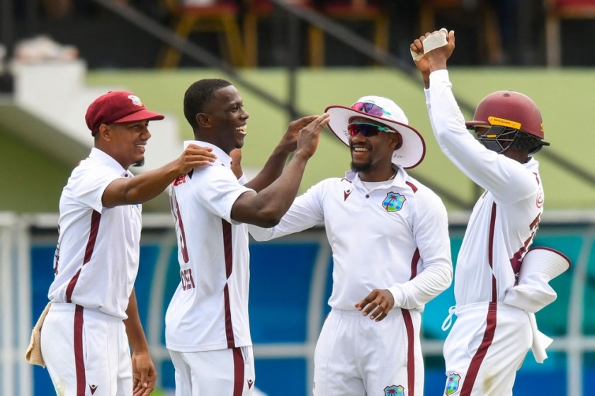 West Indies' Shamar Joseph (second from left), Gudakesh Motie (left) and Kavem Hodge (third from left) celebrate the elimination of South Africa's David Bedingham
