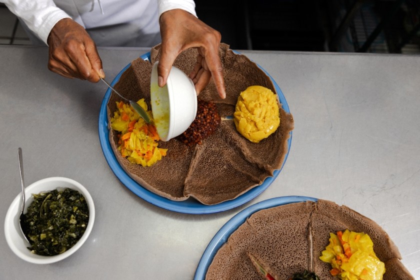 Genet Agonafer, chef and owner of Meals by Genet, prepares a dish at his Los Angeles restaurant.