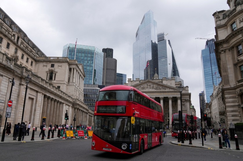 Buses go past the Bank of England building, in London, Britain. — Reuters