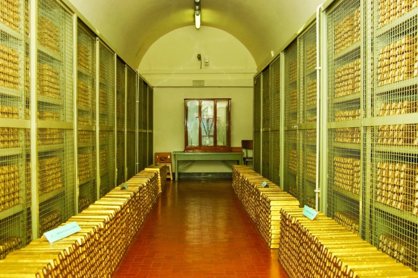 A secure room inside the Bank of Italy’s gold vault is filled with stacked gold bars stored along the corridor and behind metal security cages in this undated handout picture, in Rome, Italy. — Reuters