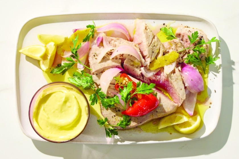 Olive oil-poached tuna with garlic aioli. Bathing fish in olive oil makes it deeply flavorful and juicy